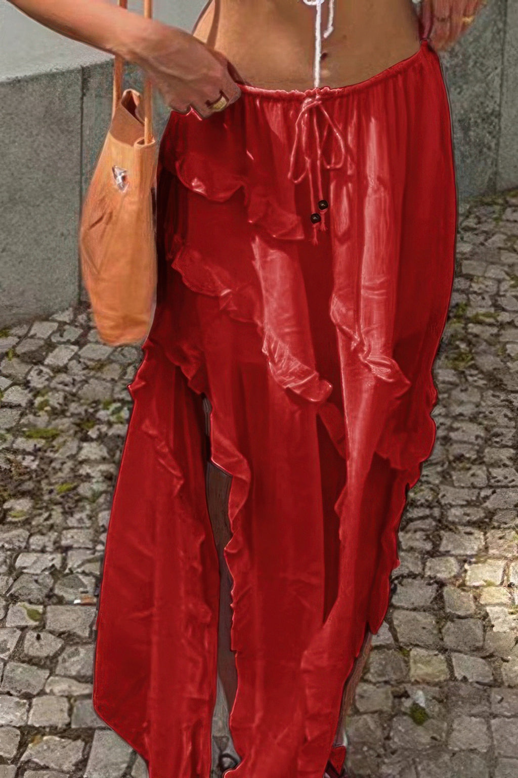Red ruffle drawstring waist skirt with a flowy design, perfect for summer outings