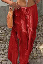 Red ruffle drawstring waist skirt with a flowy design, perfect for summer outings