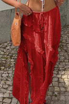 Red ruffle drawstring waist skirt with a flowy design, perfect for summer outings