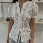Women's white ruffle frill blouse, perfect for casual outings