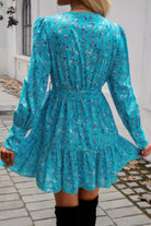 VacationGrabs ruffled surplice mini dress in blue floral print with long sleeves and a flared hem