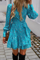 VacationGrabs ruffled surplice mini dress in turquoise with floral print and long sleeves