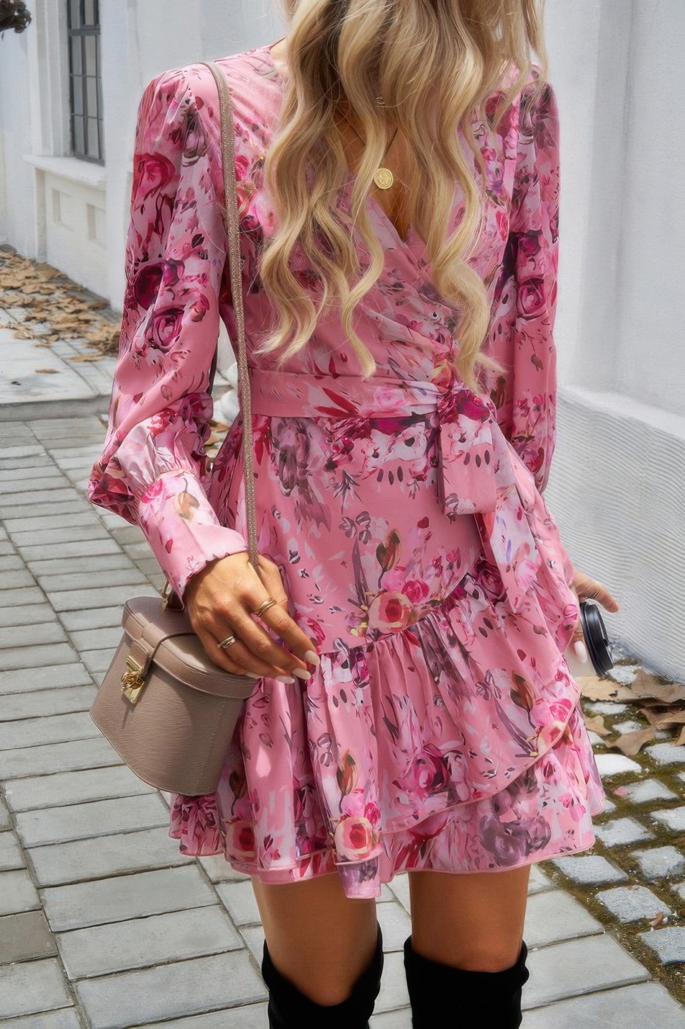 Women's ruffled surplice mini dress in pink floral pattern with long sleeves and waist tie