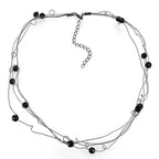 Elegant ruthenium white metal necklace with multiple strands and black bead accents for a chic look