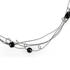 Stylish ruthenium white metal necklace with black beads, perfect for chic fashion looks