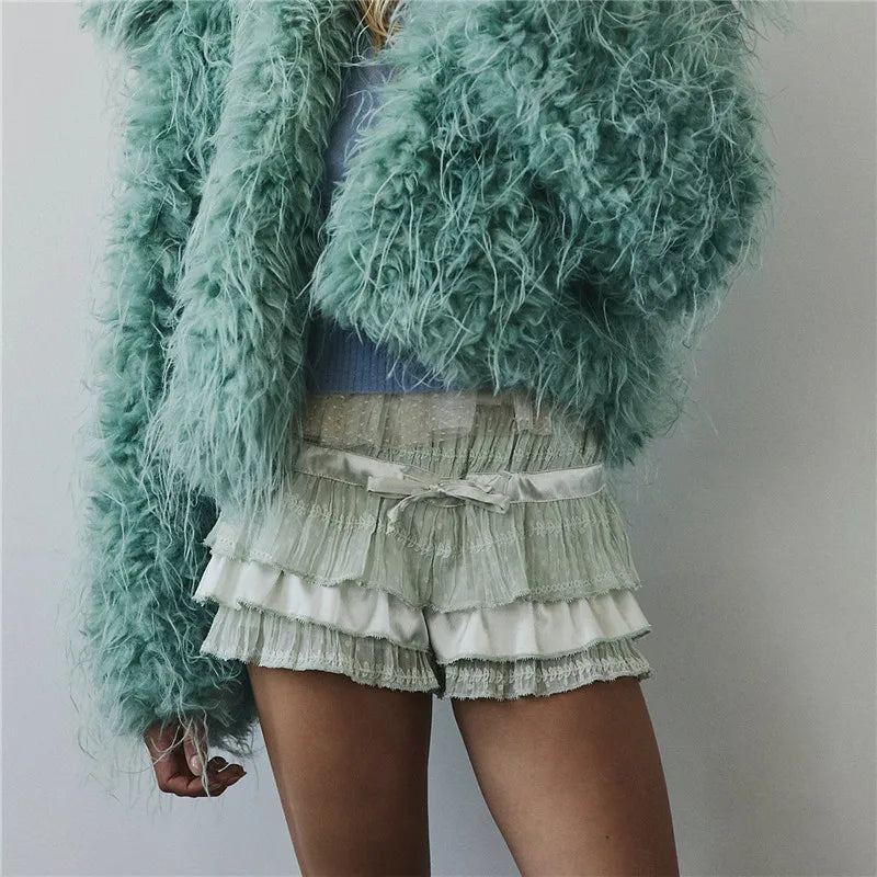 Women's satin and lace shorts in mint green, perfect for casual outings