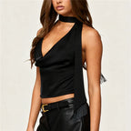 Black satin halter top with fringe detail for stylish evening wear