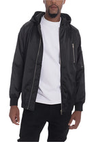 WEIV satin hooded windbreaker jacket in black worn over white t-shirt with zippered pockets