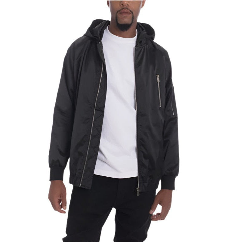 WEIV satin hooded windbreaker jacket in black worn over white t-shirt with zippered pockets