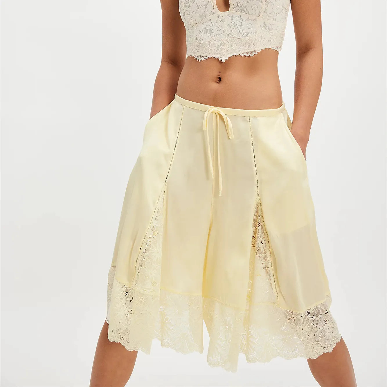 Women's yellow satin pajamas with lace accents for comfortable lounging