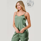 Plus size satin tank top for women in green, featuring adjustable straps and a relaxed fit