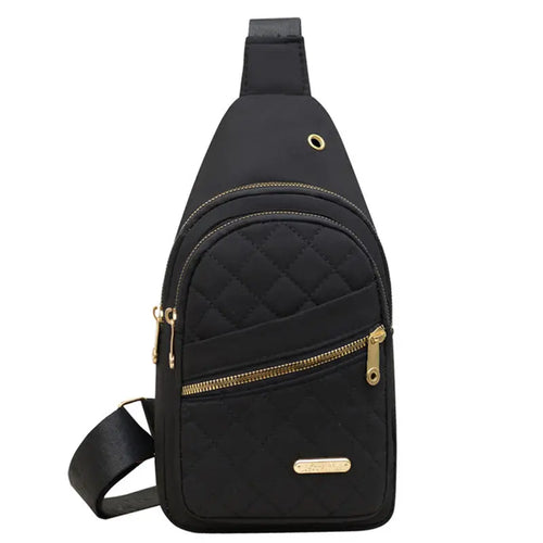 Black quilted sling bag for travel, featuring multiple pockets