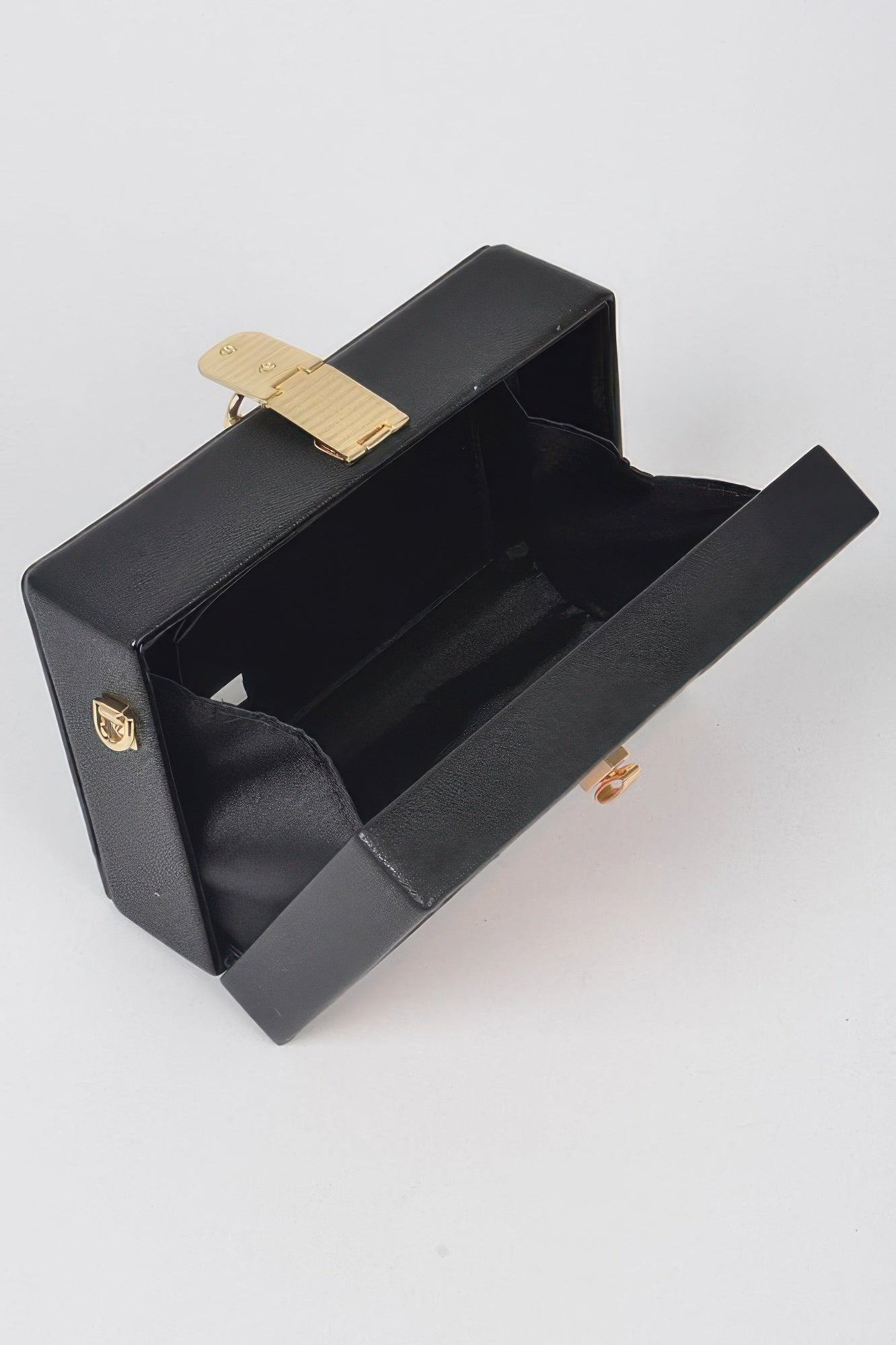 Black secure clutch bag for pencils with a gold clasp and spacious interior