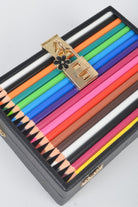 Stylish secure clutch bag for pencils with a gold clasp and colorful pencil assortment inside