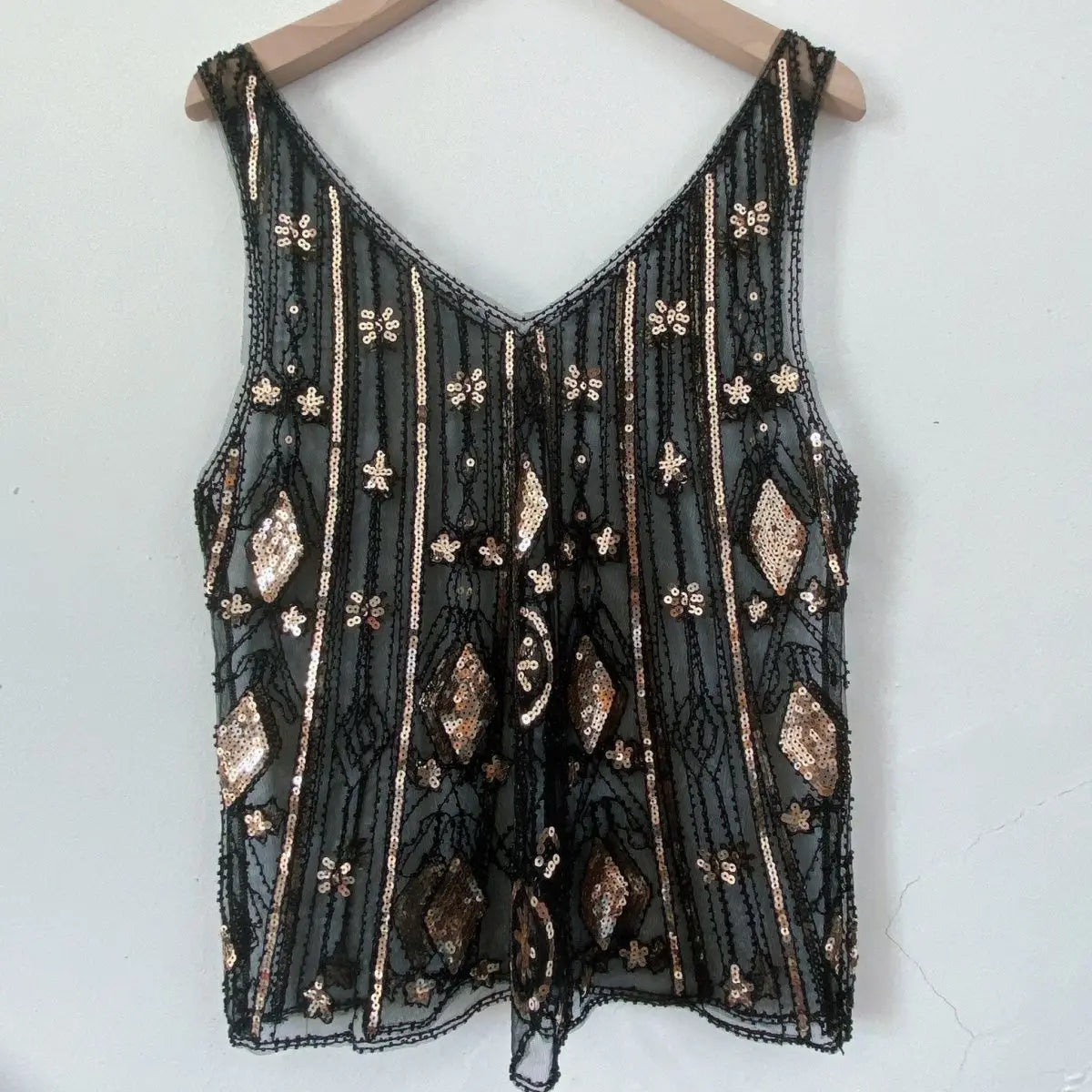 Women's black sequin top with intricate embroidery for festive occasions