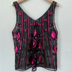 Women's sequin top in black with pink floral patterns for festive occasions
