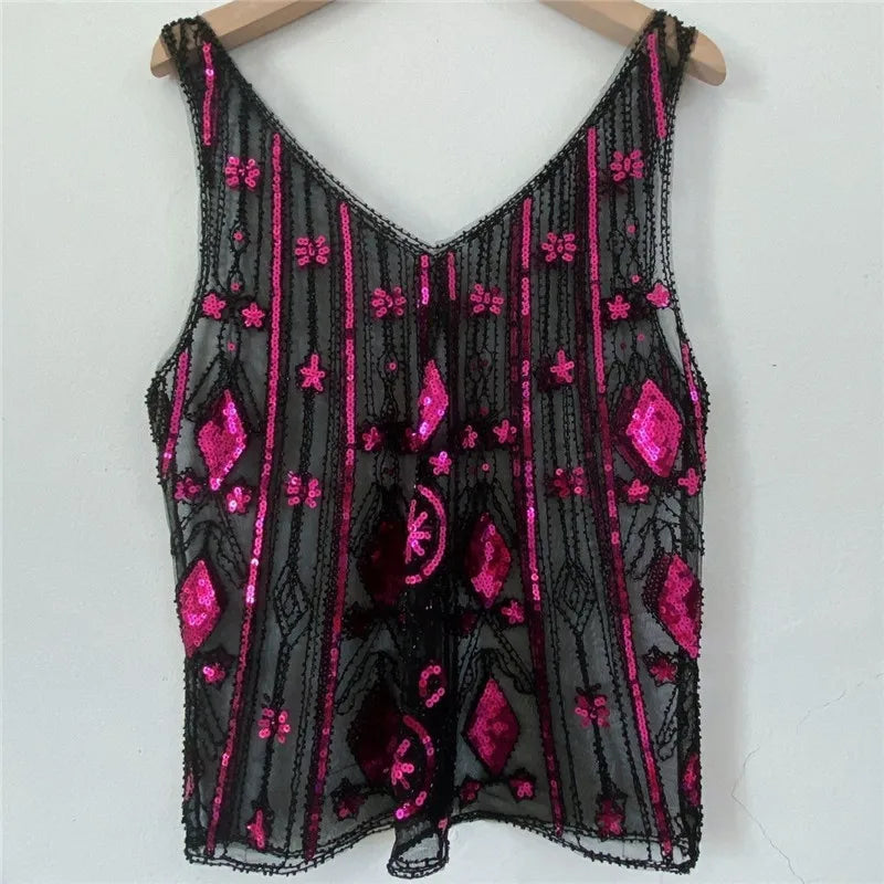 Women's sequin top in black with pink floral patterns for festive occasions