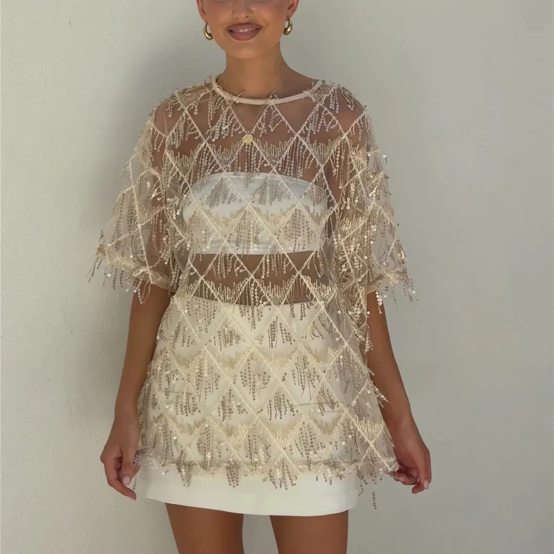 Women's sequin top in champagne color, perfect for parties