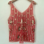 Women's coral sequin top, perfect for evening outings