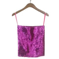 Shiny pink sequin tube top for women with thin straps hanging on wooden hanger