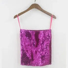Shiny pink sequin tube top for women with thin straps hanging on wooden hanger