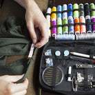 Sewing kit with colorful threads, needles, and measuring tape for DIY projects