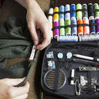 Sewing kit with colorful threads, needles, and measuring tape for DIY projects