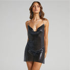 Woman wearing a black sequined sexy backless party dress for women with thin straps