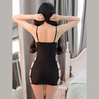 Back view of a woman wearing a sexy bandage mini dress in black with cutout sides and adjustable straps