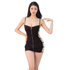 Woman wearing a black sexy bandage mini dress with spaghetti straps and cutout sides