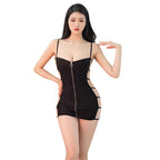 Woman wearing a black sexy bandage mini dress with spaghetti straps and cutout sides
