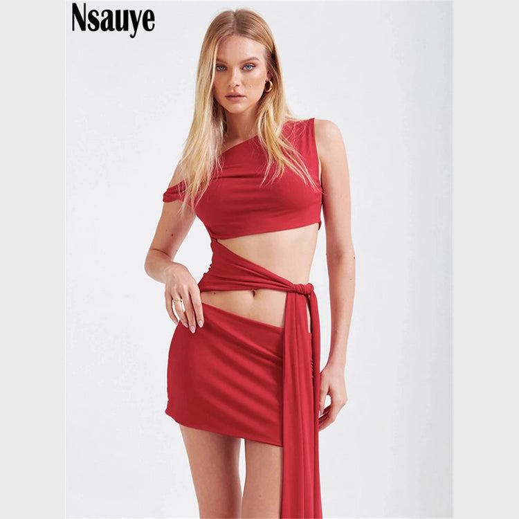 Model wearing a red sexy bandage wrap party dress with cutout details and side tie