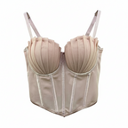 Beige corset on a hanger against a white background
