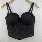 Black sexy party club bustier top with pleated cups and adjustable straps hanging on hanger