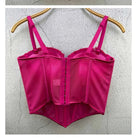 Pink sexy party club bustier top with adjustable straps hanging on a wooden hanger