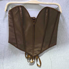 Brown sexy party club bustier top with structured seams and lace-up back detail hanging on hanger
