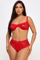 Sizzling model showcasing a sexy red bra and panty set with lace detailing for a stunning look