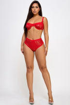 Sexy red bra and panty set featuring lace detailing for an alluring look.