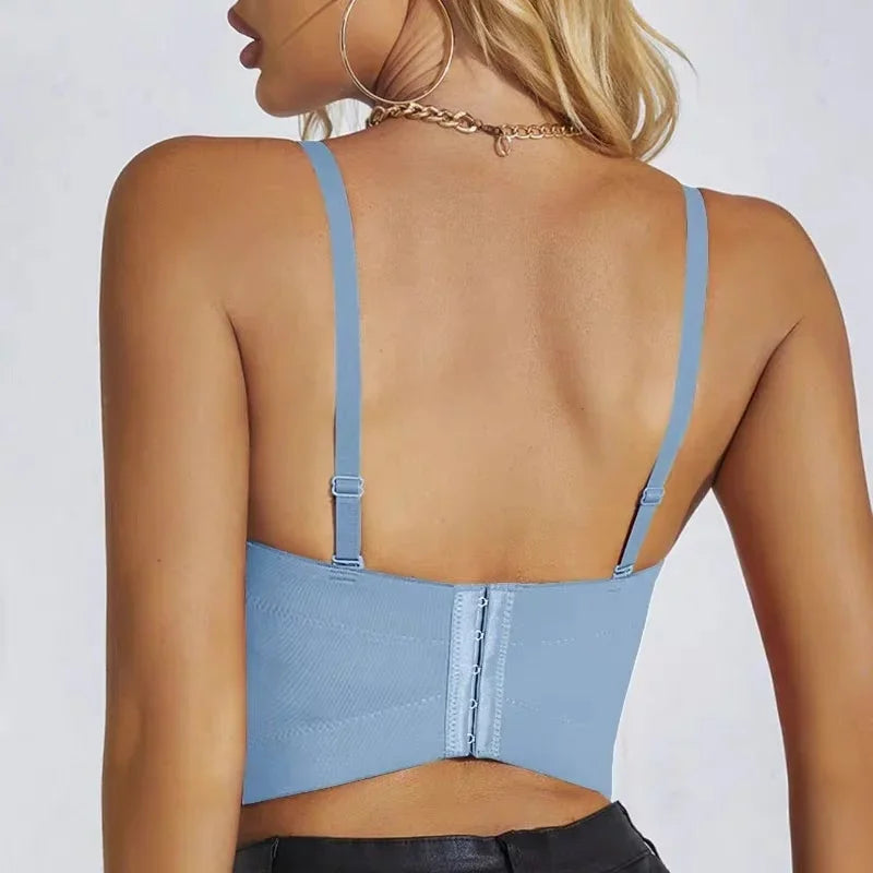 Back view of a woman wearing a blue strapless bra top with adjustable straps by VacationGrabs