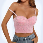 Pink sexy strapless pearl bra top with decorative pearls worn by woman with jeans