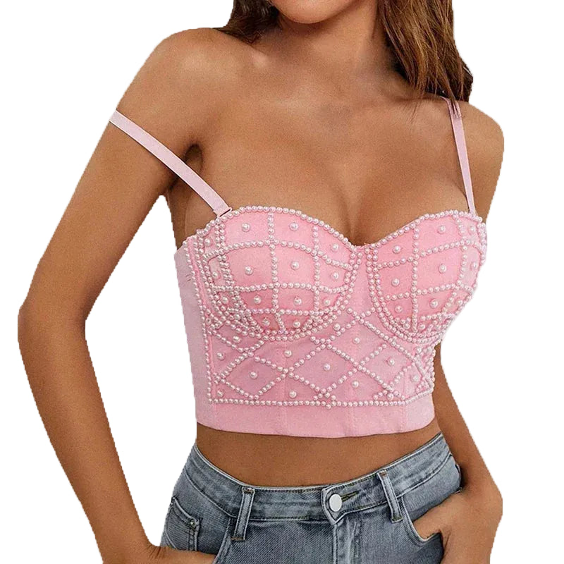 Pink sexy strapless pearl bra top with decorative pearls worn by woman with jeans
