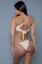 Back view of a sexy strappy bikini set in nude color, featuring adjustable straps and a tied back design.