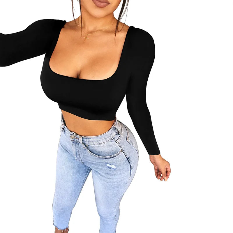 Black long sleeve sexy summer crop top for women paired with light blue high waist jeans