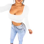 White sexy summer crop top for women paired with light blue high-waisted jeans from VacationGrabs