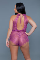 Purple sexy vacation romper with lace detailing and open back design for stylish outings
