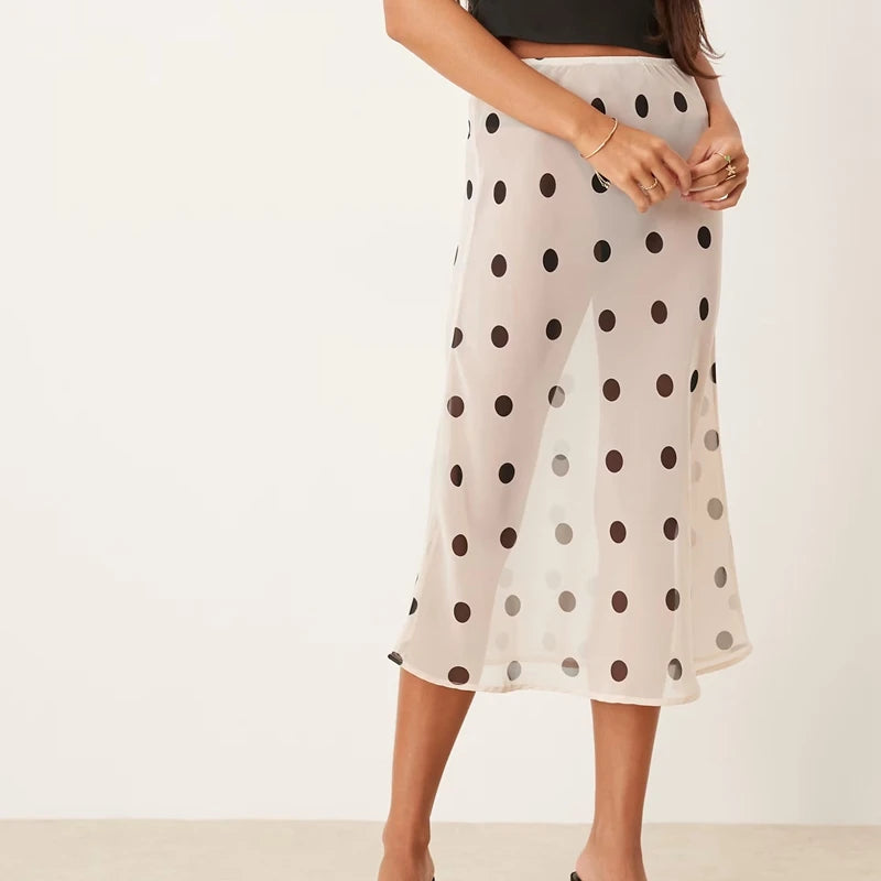 Sheer midi skirt with polka dots, ideal for summer outings
