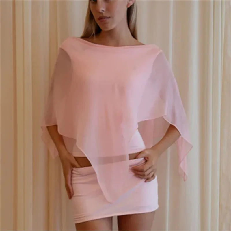 Women's sheer poncho in soft pink, perfect for beach cover-up