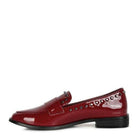 Stylish women's shiny black loafers with decorative studs and a comfortable flat design