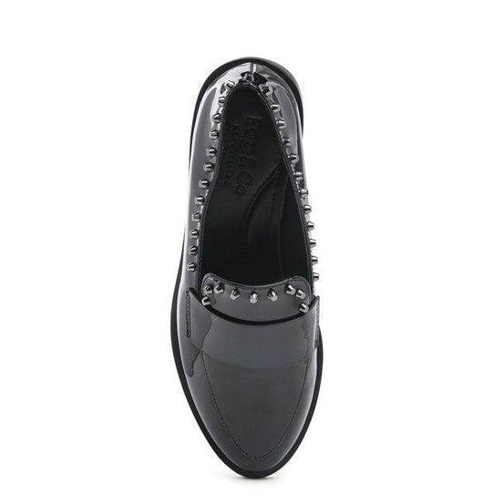 Stylish shiny black loafers for women featuring studded accents for a chic look