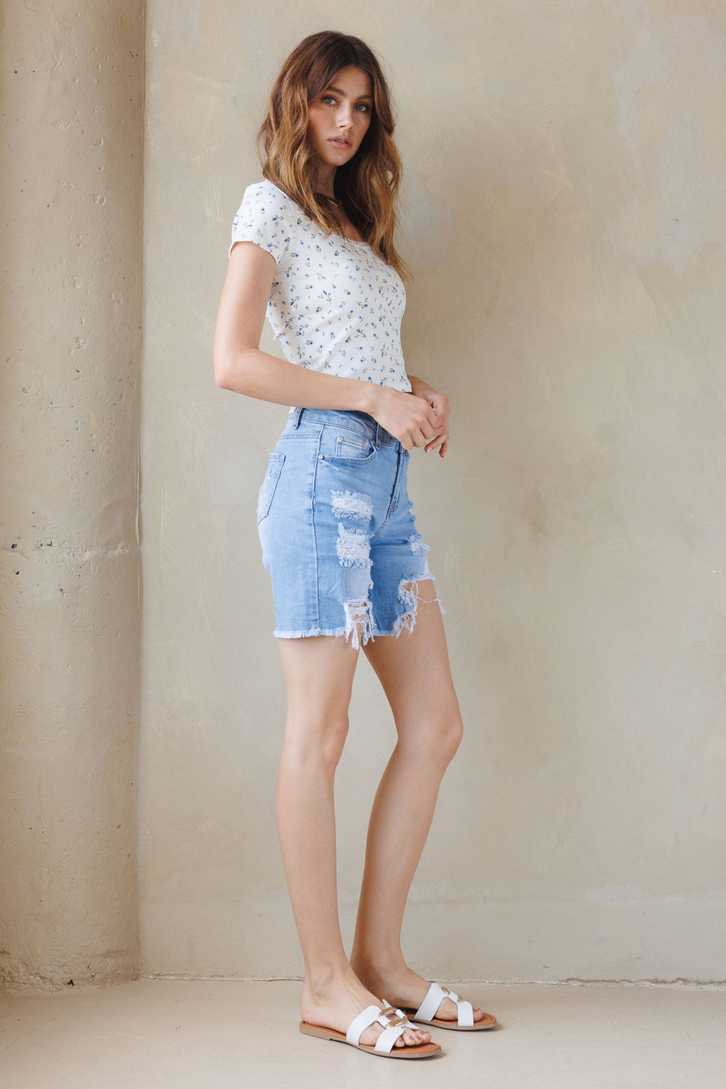 women's distressed denim shorts in light blue, casual summer wear